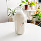 The Happy Milk Bottle (32 oz)